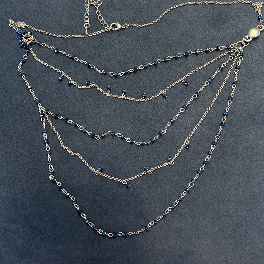 Multi strand single necklace